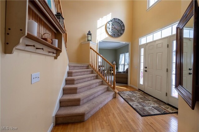 4615 Lexington Ridge Dr, Medina, OH 44256 - foyer entrance with a towering ceiling, hardwood / wood-style flooring, plenty of natural light, and stairs
