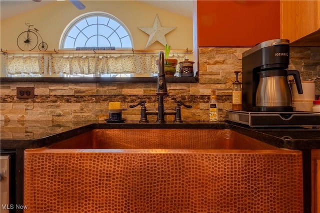 kitchen with sink and vaulted ceiling