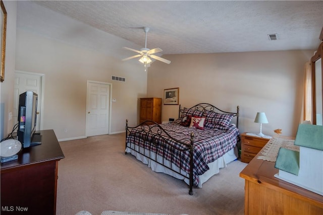 carpeted bedroom featuring ceiling fan, high vaulted ceiling, and a textured ceiling