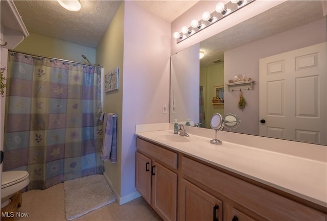 bathroom featuring vanity, curtained shower, toilet, and a textured ceiling