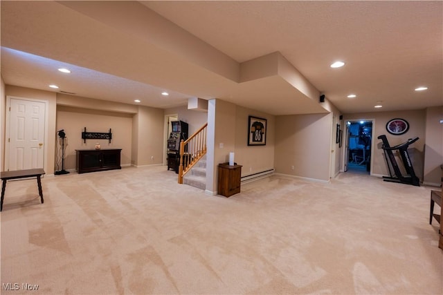 basement featuring carpet flooring and baseboard heating