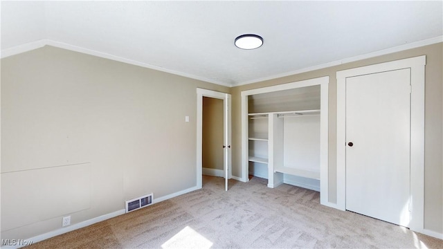 unfurnished bedroom with crown molding and light colored carpet