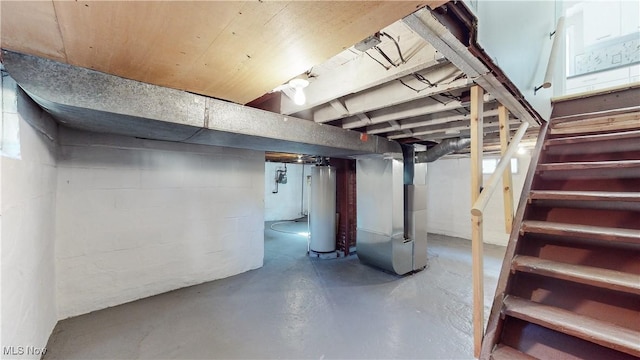 basement with water heater and heating unit