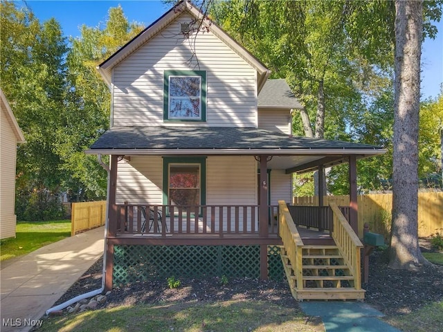 back of property featuring a porch