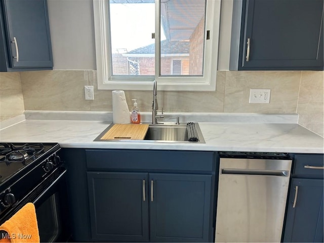 kitchen featuring blue cabinets, sink, and backsplash