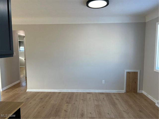 spare room featuring light hardwood / wood-style flooring