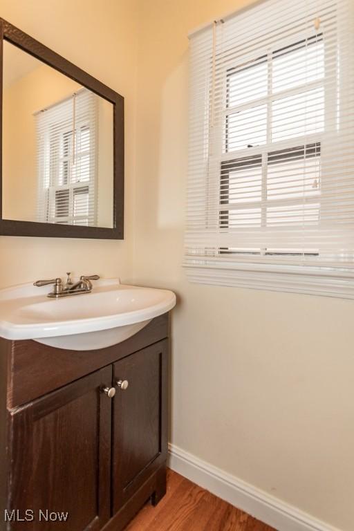 bathroom with vanity and hardwood / wood-style floors