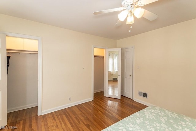 unfurnished bedroom with hardwood / wood-style flooring and ceiling fan