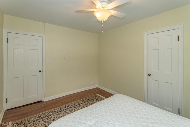 bedroom featuring hardwood / wood-style flooring and ceiling fan