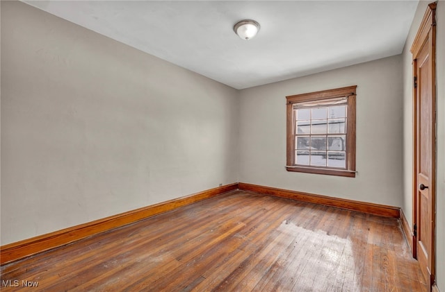 unfurnished room featuring wood-type flooring