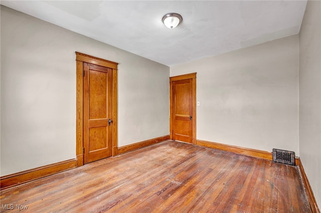 spare room featuring light hardwood / wood-style floors