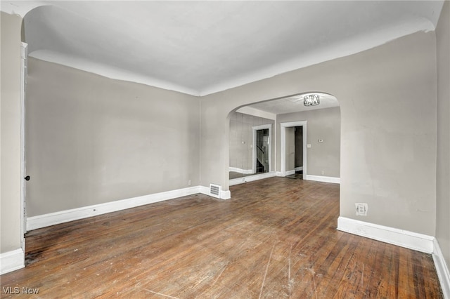 spare room featuring dark hardwood / wood-style floors