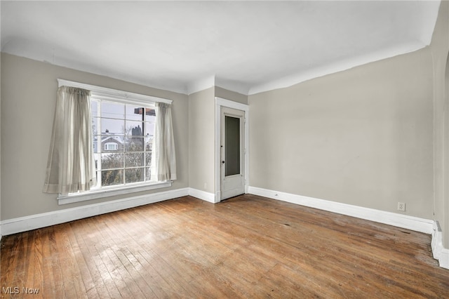 unfurnished room featuring hardwood / wood-style flooring