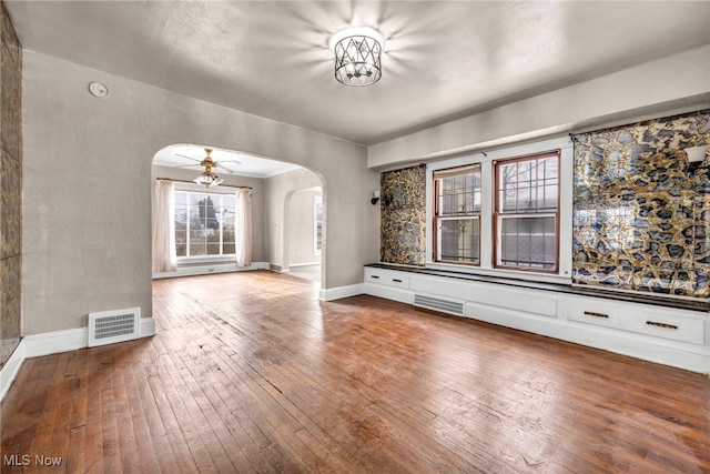 unfurnished room featuring hardwood / wood-style floors and ceiling fan