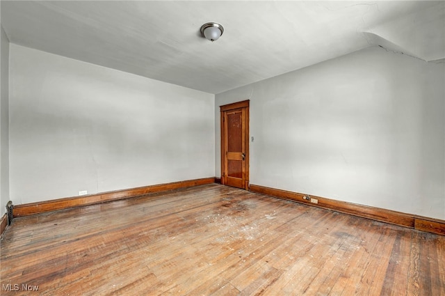 spare room featuring hardwood / wood-style flooring