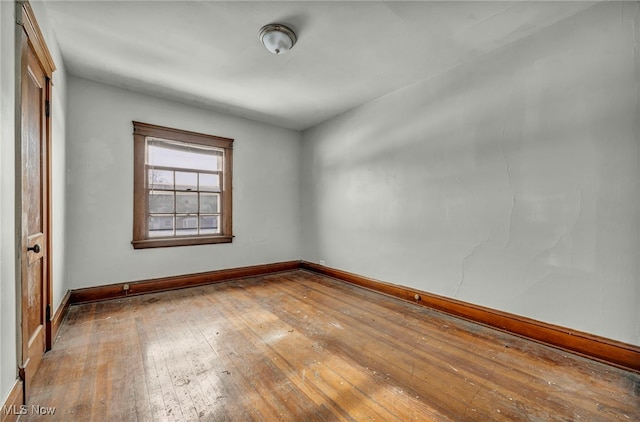 unfurnished room featuring hardwood / wood-style floors