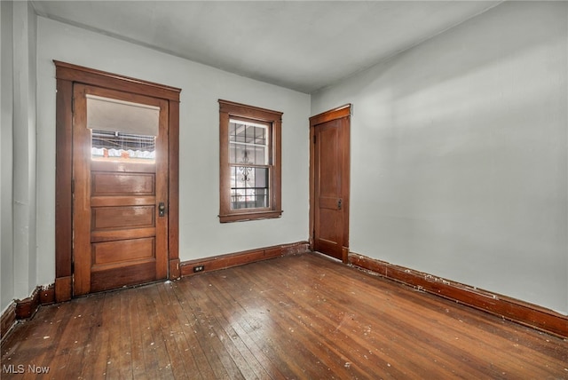 spare room with dark hardwood / wood-style floors