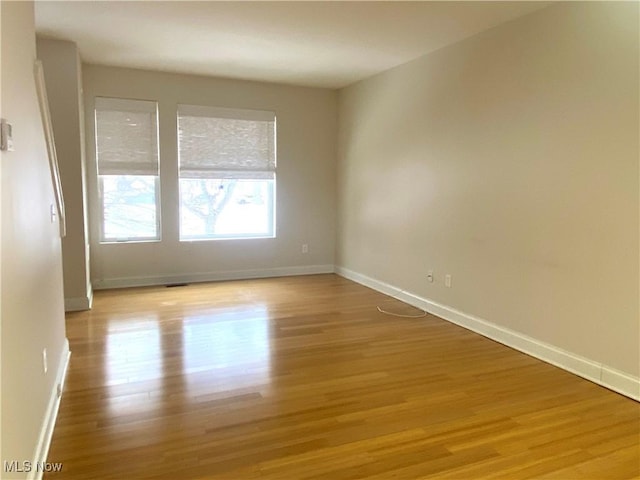 empty room with light wood-type flooring