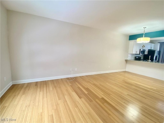 unfurnished living room featuring light hardwood / wood-style flooring