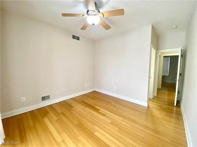 unfurnished room with ceiling fan and light hardwood / wood-style flooring