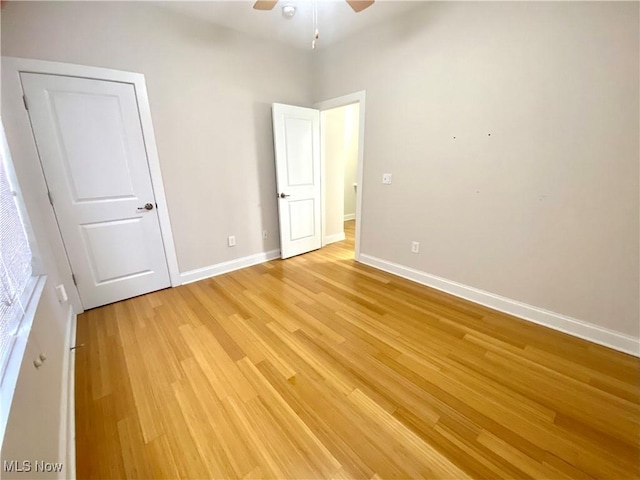 unfurnished bedroom featuring ceiling fan and light hardwood / wood-style flooring