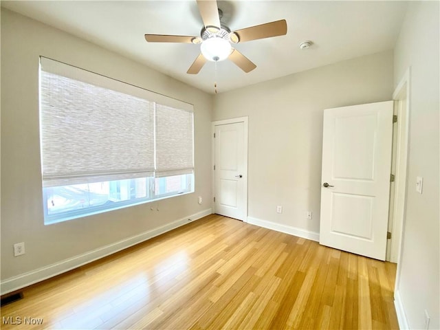 unfurnished bedroom with light hardwood / wood-style flooring and ceiling fan