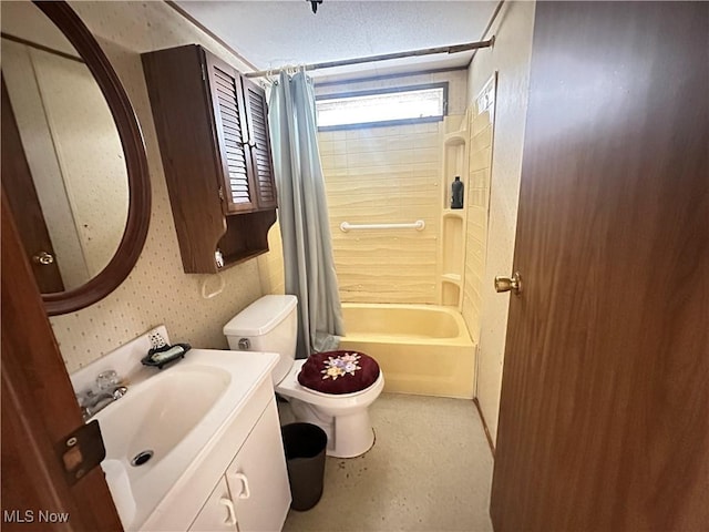 full bathroom with vanity, shower / bathtub combination with curtain, and toilet