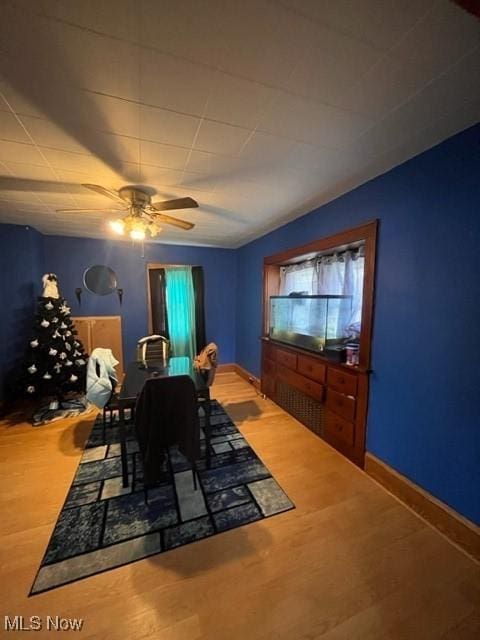 dining area featuring ceiling fan and hardwood / wood-style floors