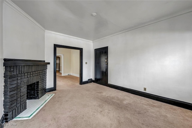 unfurnished living room with light colored carpet, ornamental molding, and a brick fireplace