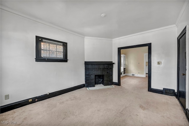 unfurnished living room with light carpet, a brick fireplace, and crown molding