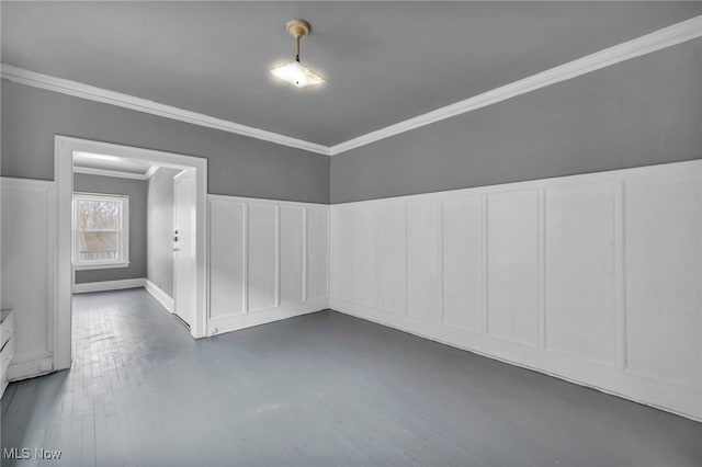 unfurnished room with dark hardwood / wood-style flooring and ornamental molding