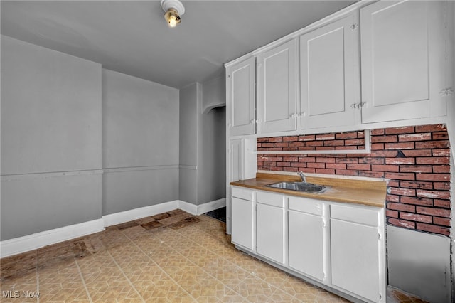 kitchen with sink and white cabinets