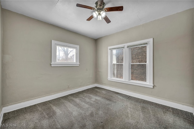 unfurnished room featuring ceiling fan and carpet