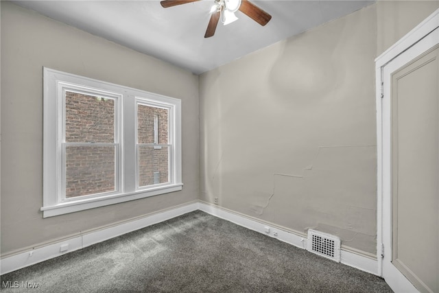 empty room with ceiling fan and carpet floors