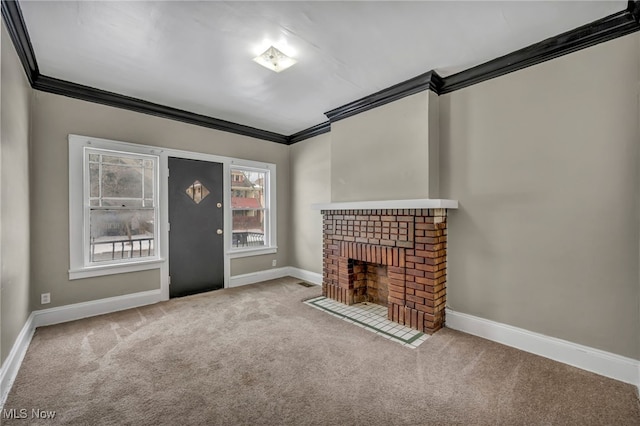 unfurnished living room with light carpet, a brick fireplace, and ornamental molding