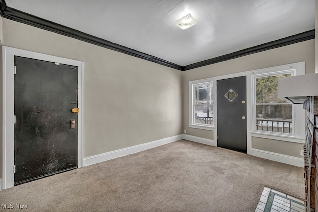 entryway featuring light carpet and crown molding