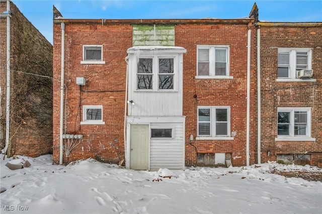 view of snow covered house