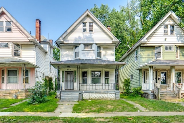 victorian-style house featuring a porch