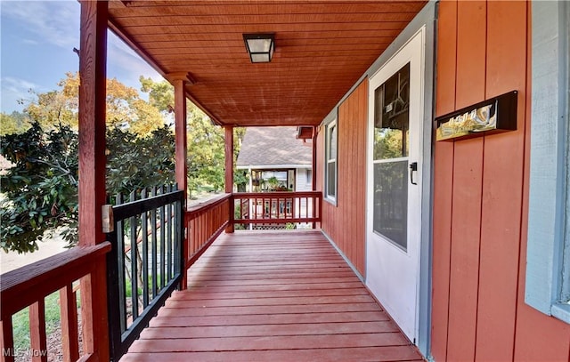 wooden terrace with a porch