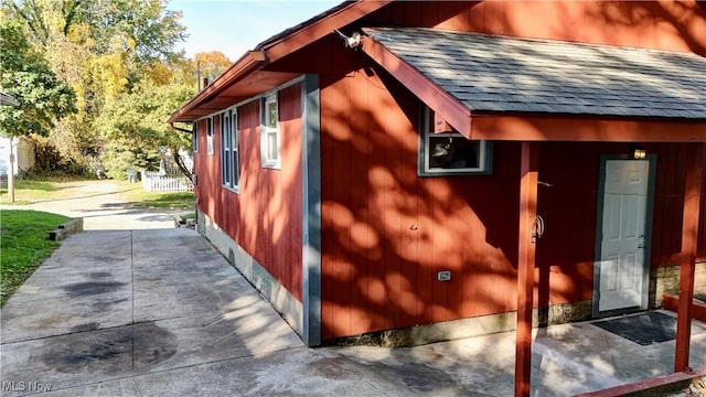 view of side of property featuring a patio area