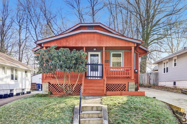 bungalow featuring a porch and a front yard