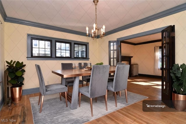 dining space with crown molding, wood-type flooring, a chandelier, and radiator heating unit