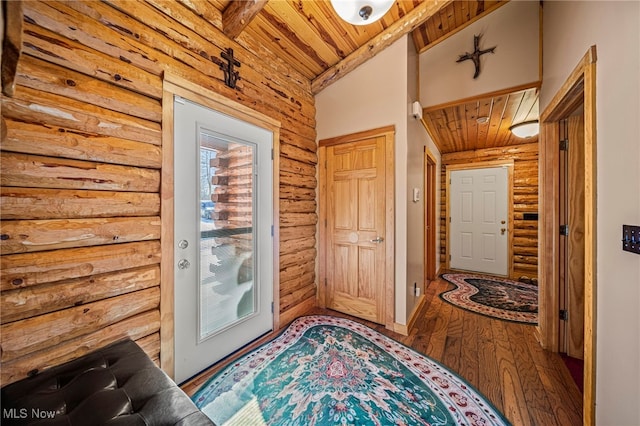 doorway to outside featuring wood-type flooring, wood ceiling, a wealth of natural light, and log walls