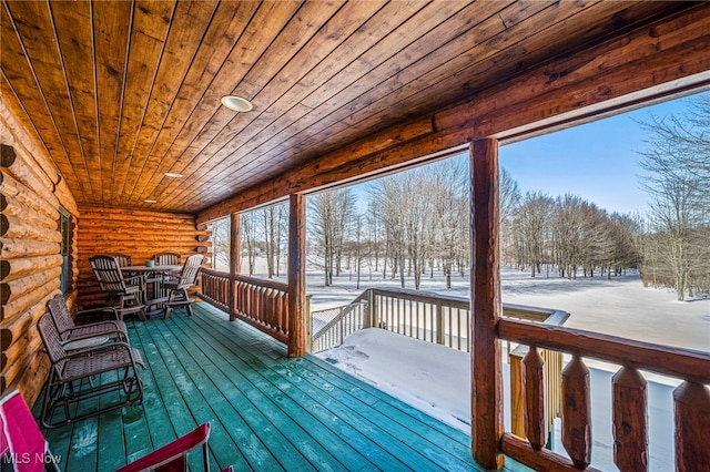 view of snow covered deck