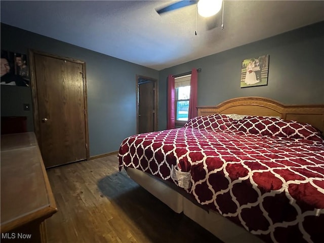 bedroom featuring hardwood / wood-style flooring and ceiling fan