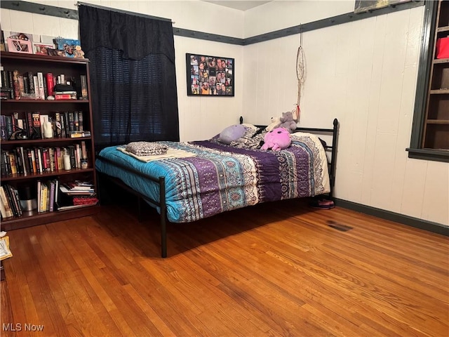 bedroom featuring hardwood / wood-style flooring