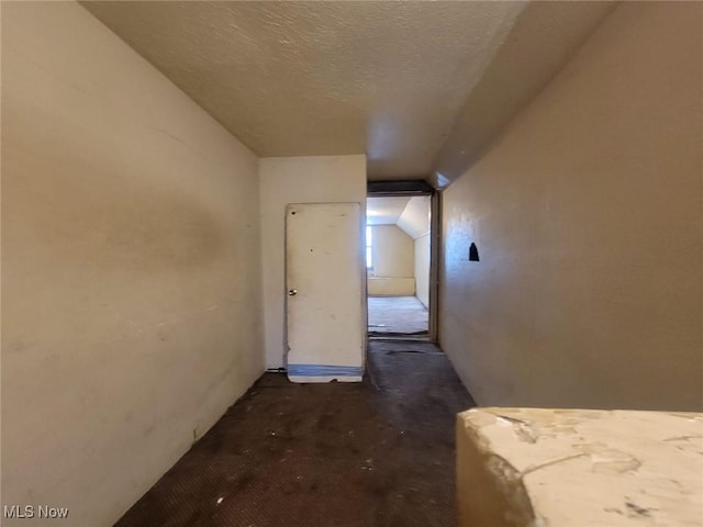 hallway featuring a textured ceiling