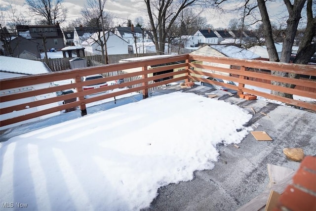 view of snow covered deck