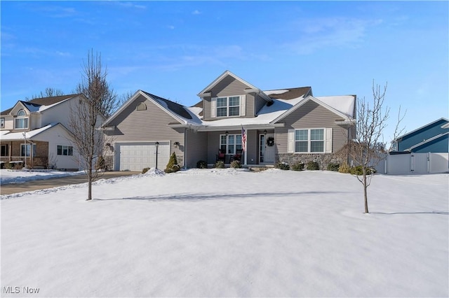 view of front of home featuring a garage and covered porch