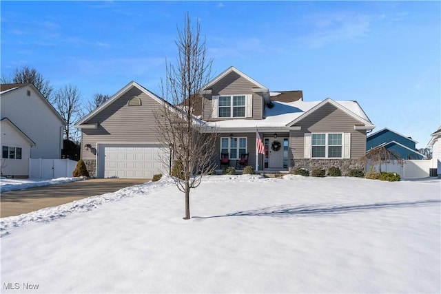 view of front of home with a porch and a garage